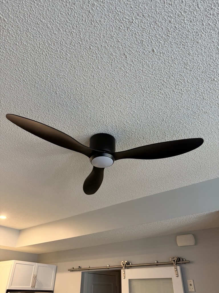 Ceiling fan installed on a textured ceiling in a Calgary home by Calgary Repairs