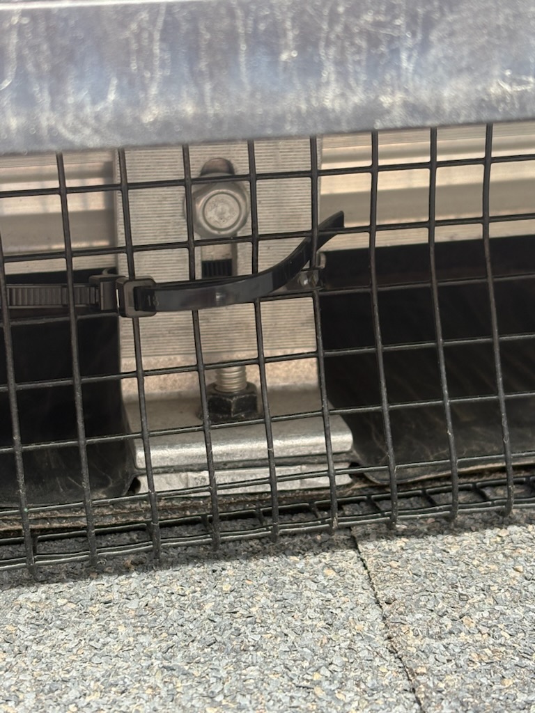 Exterior vent wire mesh cover on stone veneer wall by Calgary Repairs