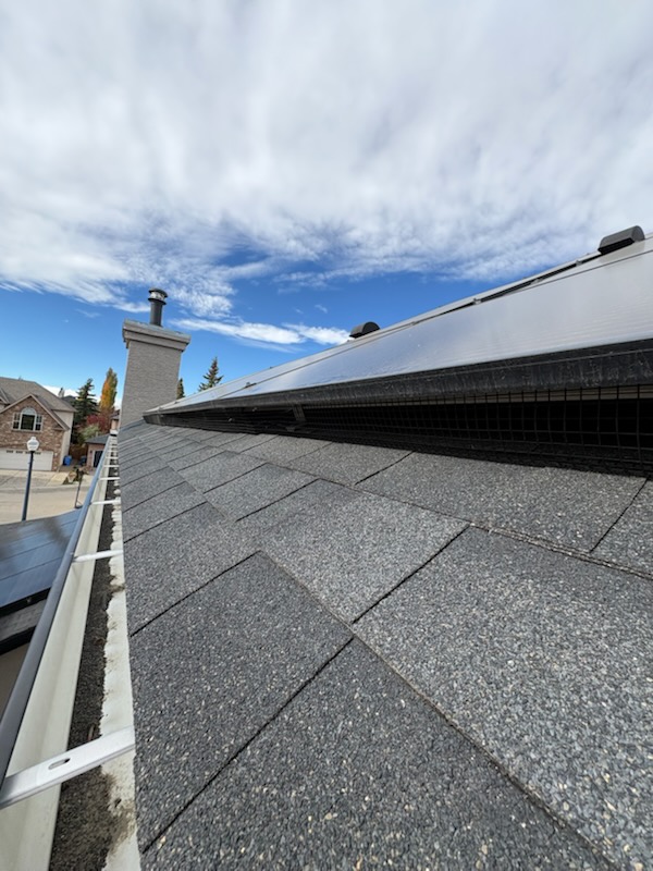 Mesh ridge vent repair on a metal roof by Calgary Repairs